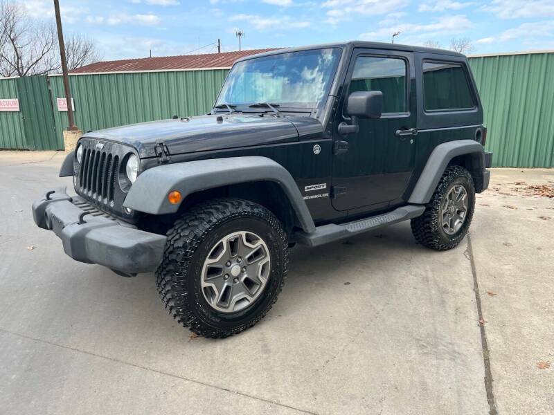 2014 Jeep Wrangler for sale at Triple C Auto Sales in Gainesville TX