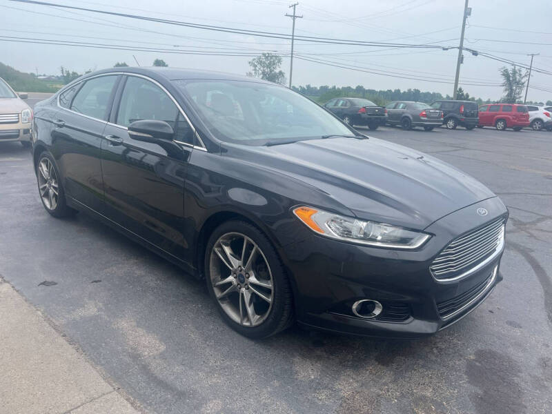 2014 Ford Fusion for sale at HEDGES USED CARS in Carleton MI