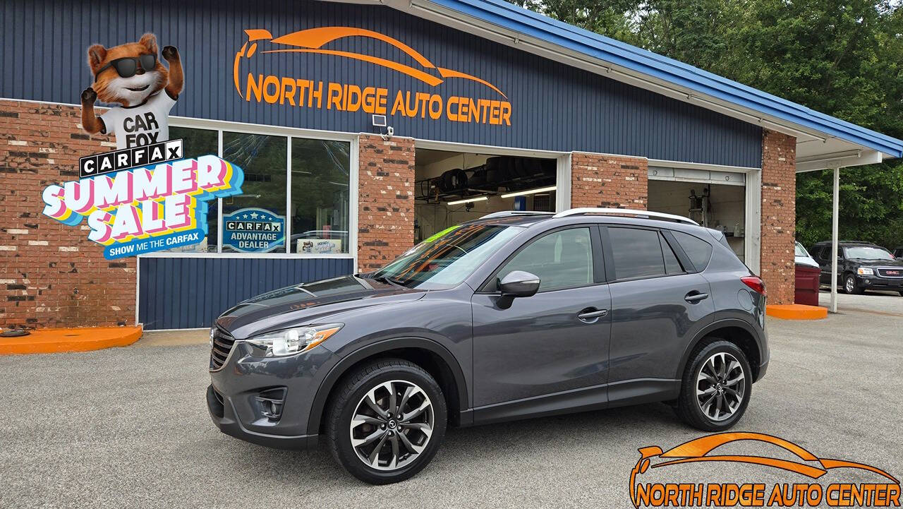 2016 Mazda CX-5 for sale at North Ridge Auto Center LLC in Madison, OH