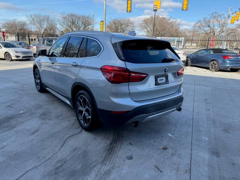 Used 2016 BMW X1 28i with VIN WBXHT3C37GP885710 for sale in Detroit, MI