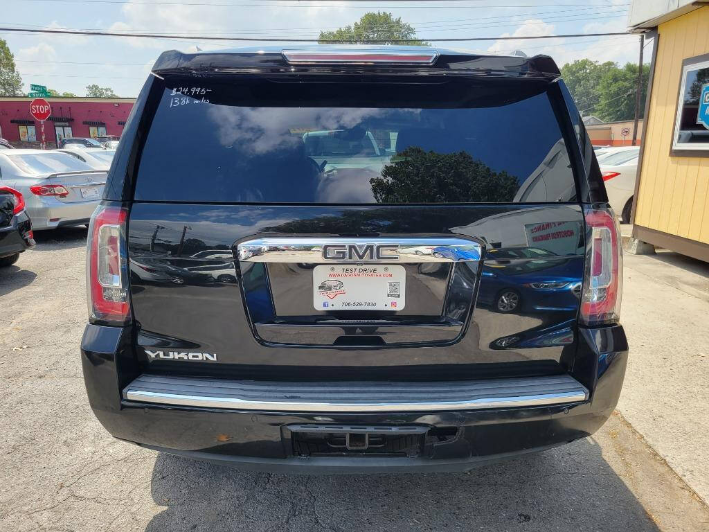 2015 GMC Yukon for sale at DAGO'S AUTO SALES LLC in Dalton, GA