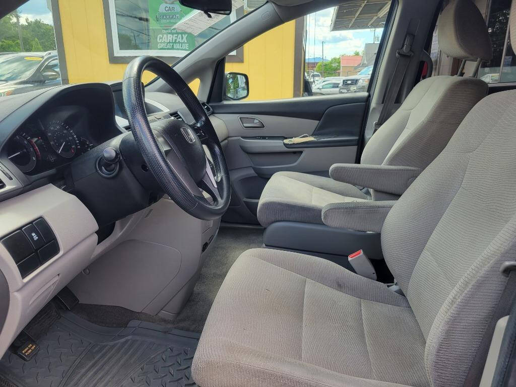 2012 Honda Odyssey for sale at DAGO'S AUTO SALES LLC in Dalton, GA