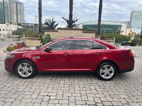 2013 Ford Taurus for sale at CYBER CAR STORE in Tampa FL