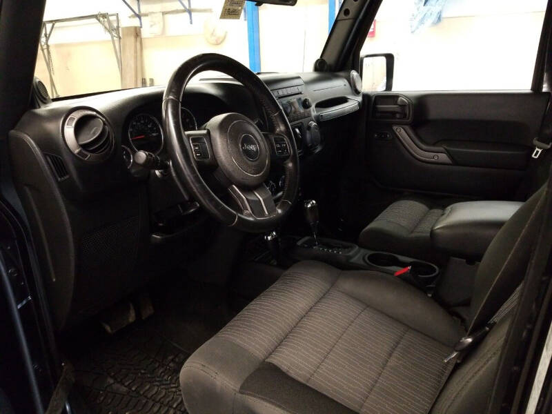 2011 Jeep Wrangler Unlimited for sale at MARVIN'S AUTO in Farmington ME
