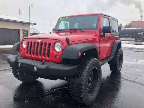 2012 Jeep Wrangler for sale at Mike's Budget Auto Sales in Cadillac MI
