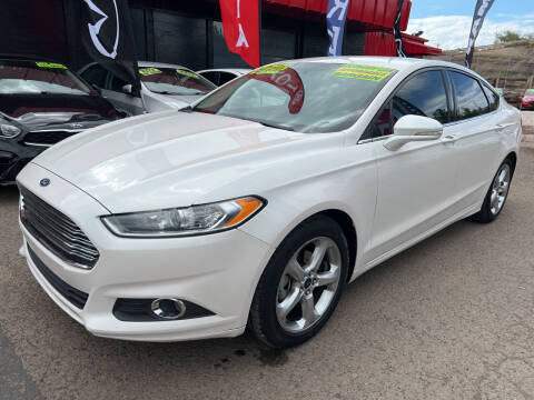 2015 Ford Fusion for sale at Duke City Auto LLC in Gallup NM