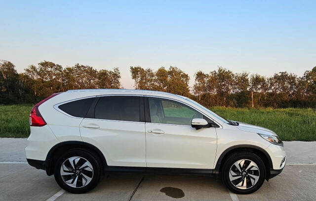 2015 Honda CR-V for sale at CAR MARKET AUTO GROUP in Sugar Land, TX