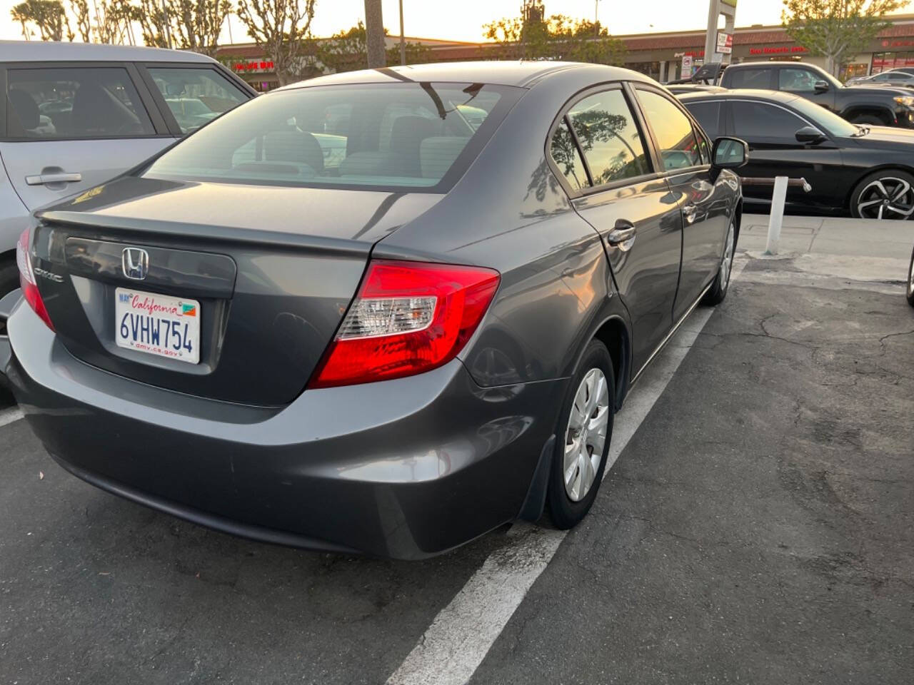 2012 Honda Civic for sale at Unique Auto Sales, Inc. in Bell, CA