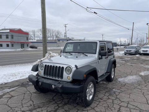 2012 Jeep Wrangler for sale at FAB Auto Inc in Roseville MI