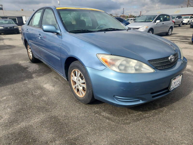 2004 Toyota Camry for sale at COMMUNITY AUTO in Fresno CA