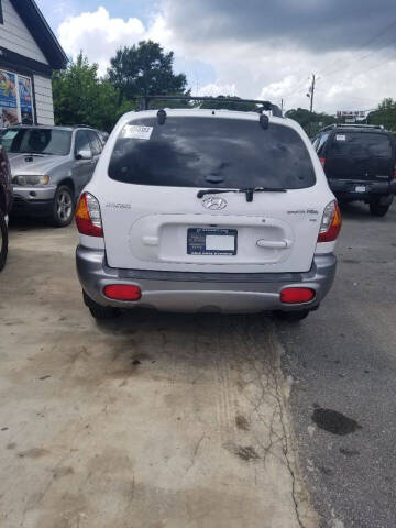 2002 Hyundai Santa Fe for sale at Palmer Automobile Sales in Decatur GA
