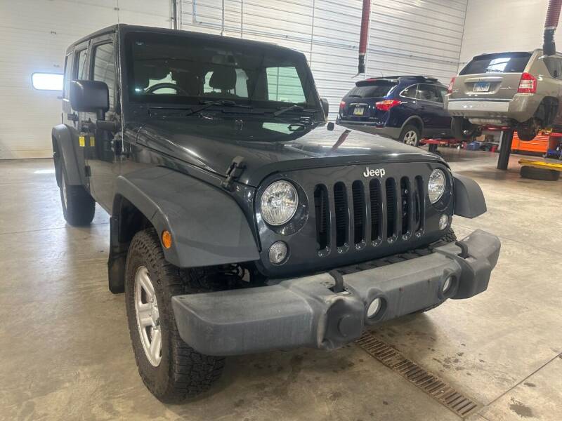 2016 Jeep Wrangler Unlimited for sale at Postal Pete in Galena IL