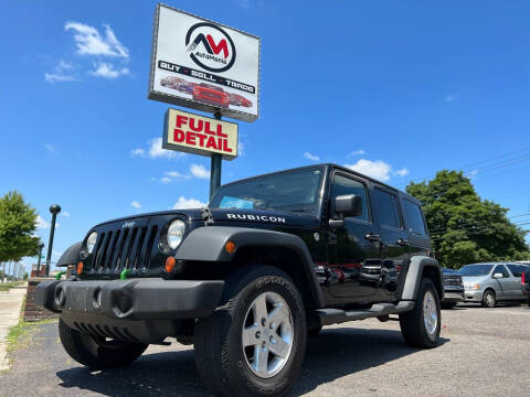 2012 Jeep Wrangler Unlimited for sale at Automania in Dearborn Heights MI