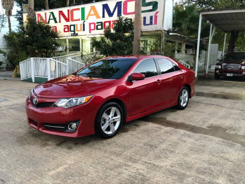 2013 Toyota Camry for sale at De La Paz Auto Sales Inc. in Houston TX