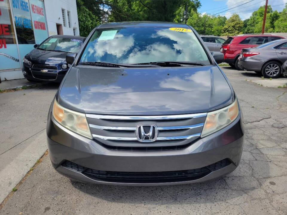 2012 Honda Odyssey for sale at DAGO'S AUTO SALES LLC in Dalton, GA