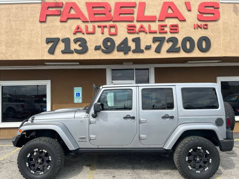 2014 Jeep Wrangler Unlimited for sale at Fabela's Auto Sales Inc. in South Houston TX