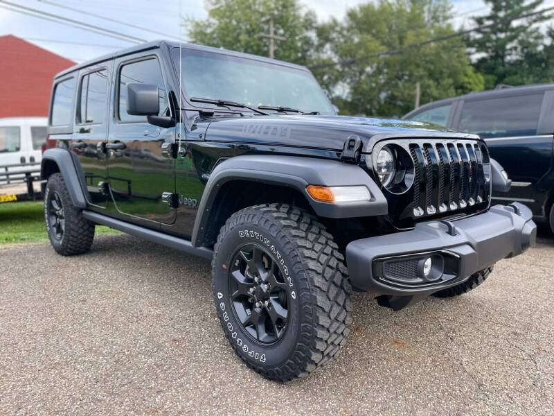 2021 Jeep Wrangler Unlimited for sale at Jim's Hometown Auto Sales LLC in Byesville OH