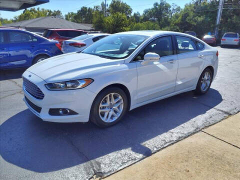 2015 Ford Fusion for sale at HOWERTON'S AUTO SALES in Stillwater OK