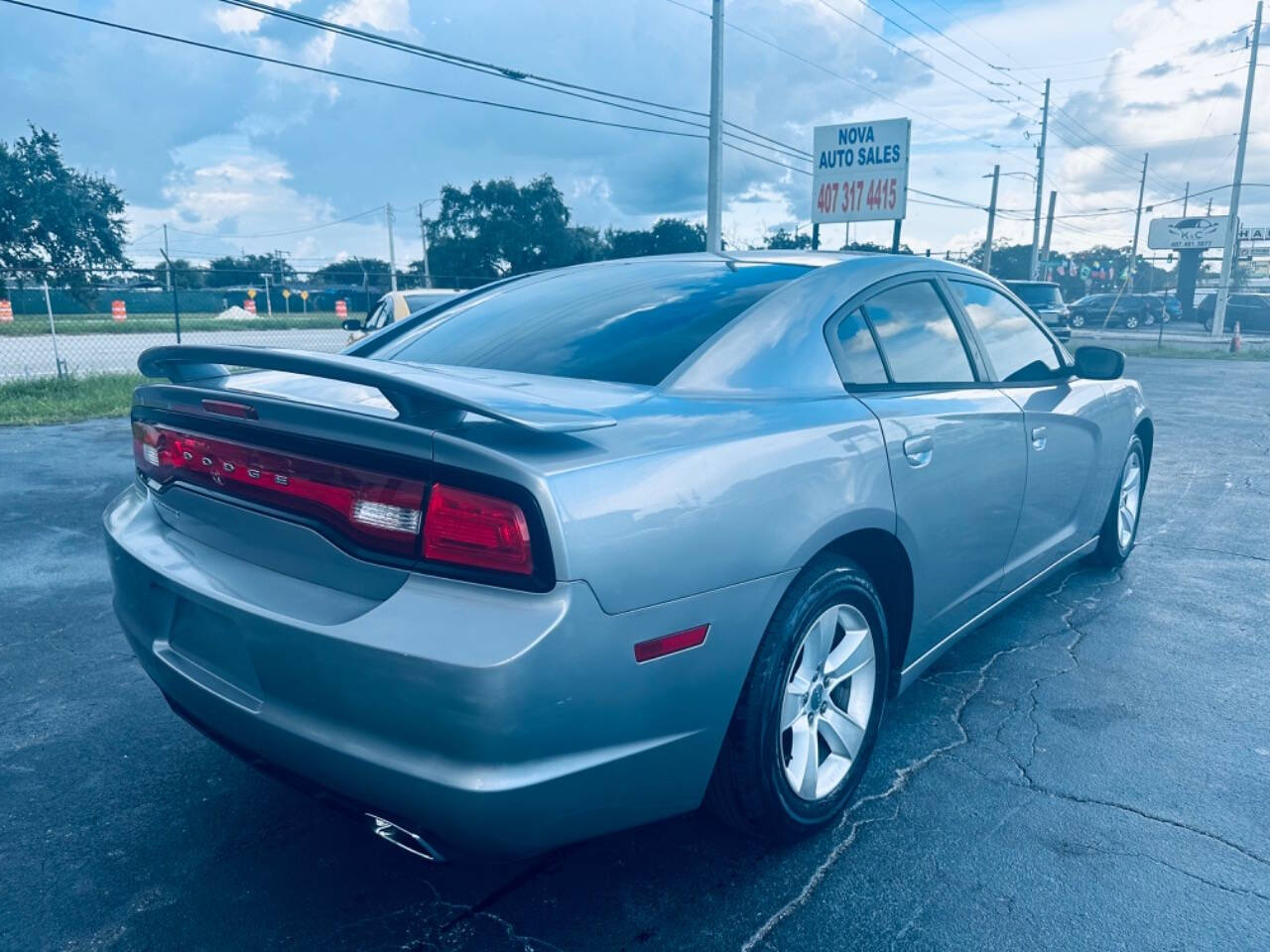 2013 Dodge Charger for sale at NOVA AUTO SALES in Orlando, FL