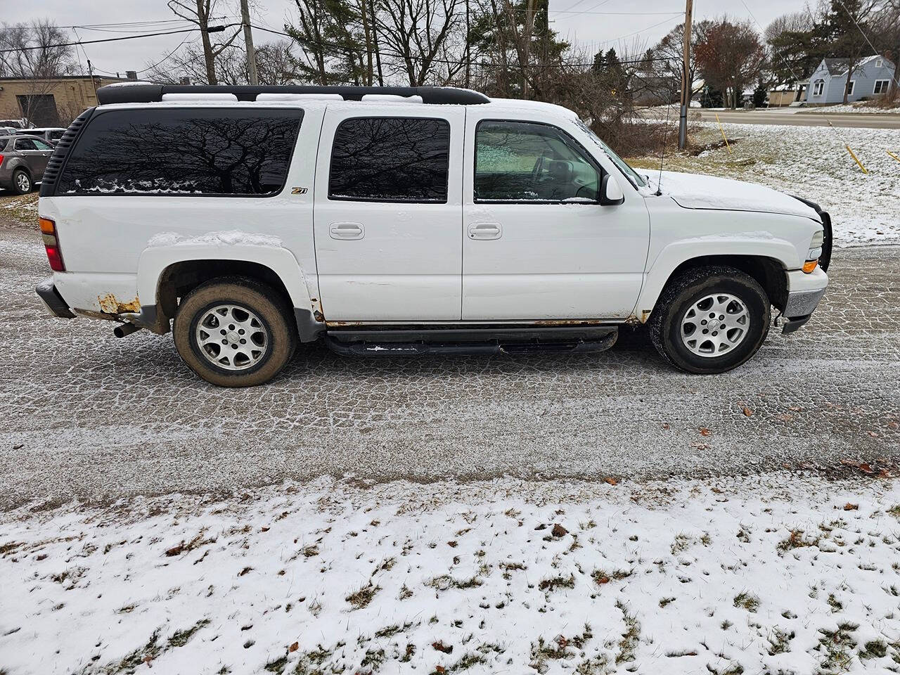 2003 Chevrolet Suburban for sale at WAGNER AUTO MART LLC in Ann Arbor, MI