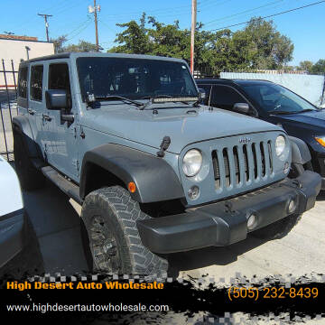 2014 Jeep Wrangler Unlimited for sale at High Desert Auto Wholesale in Albuquerque NM