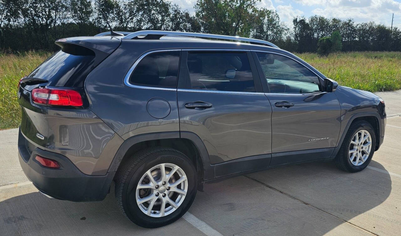 2017 Jeep Cherokee for sale at CAR MARKET AUTO GROUP in Sugar Land, TX