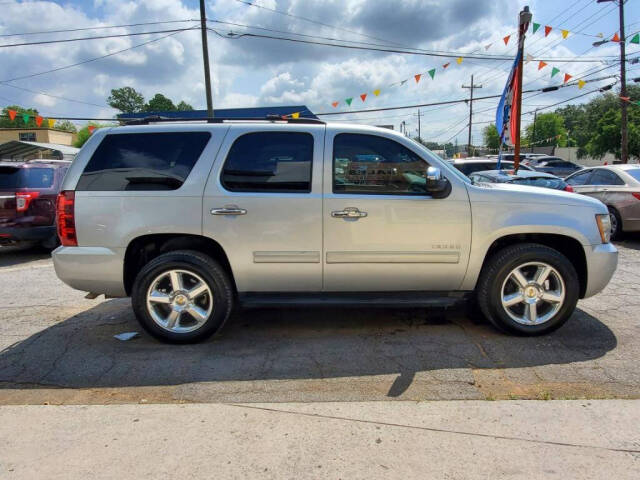 2011 Chevrolet Tahoe for sale at DAGO'S AUTO SALES LLC in Dalton, GA