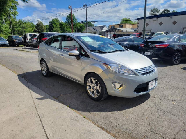 2013 Ford Fiesta for sale at DAGO'S AUTO SALES LLC in Dalton, GA