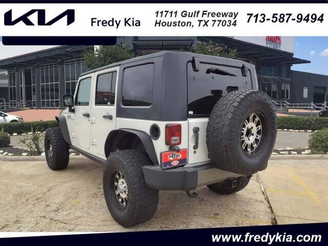 Used 2010 Jeep Wrangler Unlimited Sport with VIN 1J4BB3H10AL130890 for sale in Houston, TX