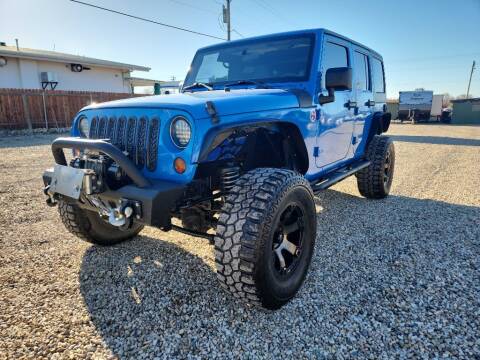 2011 Jeep Wrangler Unlimited for sale at Huntsman Wholesale LLC in Melba ID