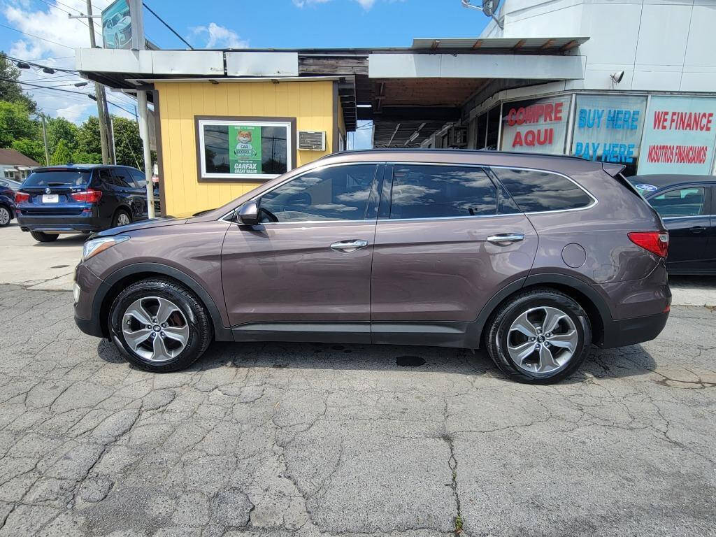 2015 Hyundai SANTA FE for sale at DAGO'S AUTO SALES LLC in Dalton, GA