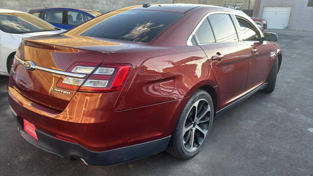 2014 Ford Taurus for sale at Ganda Auto Sales in Denver, CO