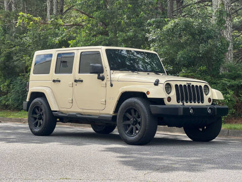 2011 Jeep Wrangler Unlimited for sale at H and S Auto Group in Canton GA