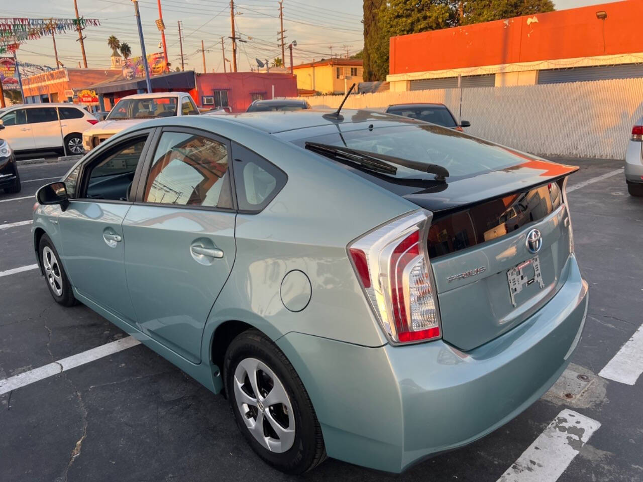 2012 Toyota Prius for sale at Unique Auto Sales, Inc. in Bell, CA