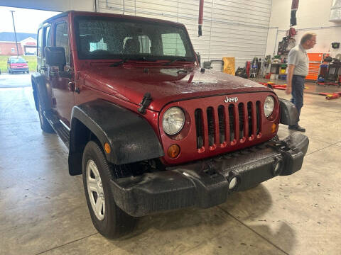 2013 Jeep Wrangler Unlimited for sale at Postal Pete in Galena IL