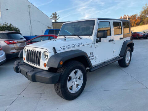 2010 Jeep Wrangler Unlimited for sale at Delta Auto Sales in Marietta GA