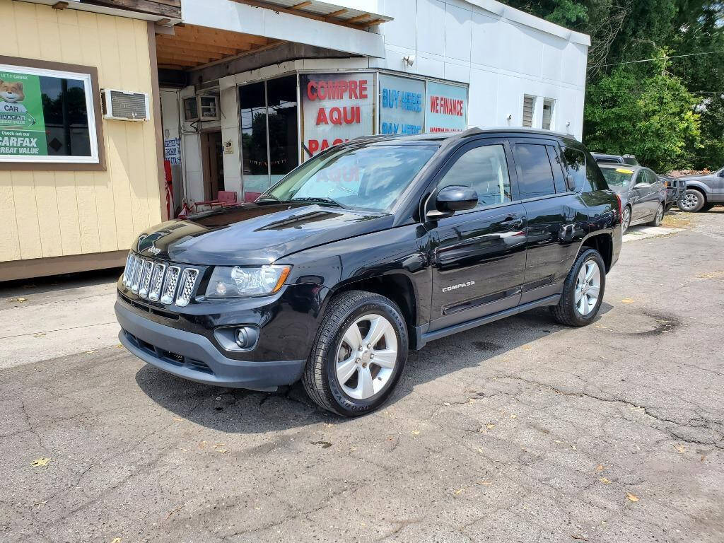 2016 Jeep Compass for sale at DAGO'S AUTO SALES LLC in Dalton, GA