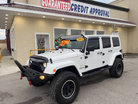 2013 Jeep Wrangler Unlimited for sale at Suarez Auto Sales in Port Huron MI