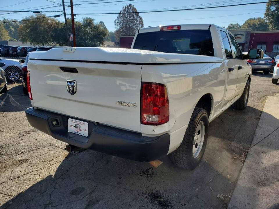 2014 Ram 1500 for sale at DAGO'S AUTO SALES LLC in Dalton, GA