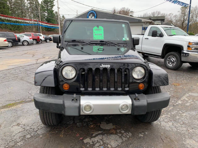 2009 Jeep Wrangler Unlimited for sale at Chuckie Bizzarro's Fleetwing Auto in Erie, PA