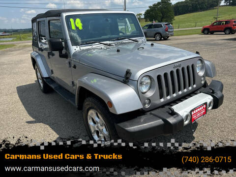 2014 Jeep Wrangler Unlimited for sale at Carmans Used Cars & Trucks in Jackson OH