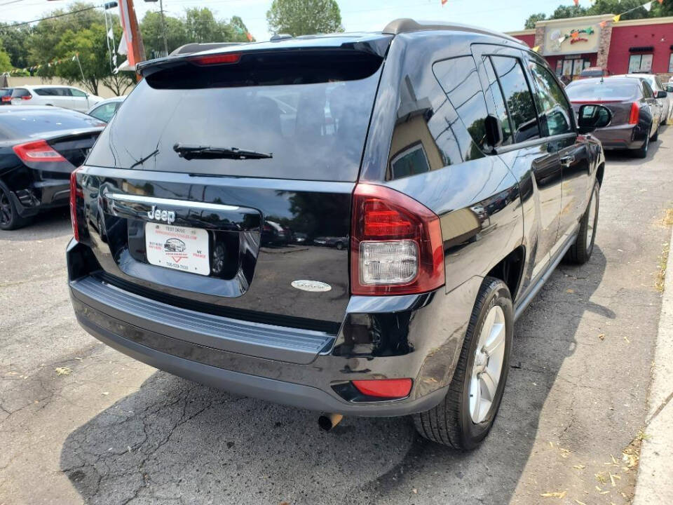 2016 Jeep Compass for sale at DAGO'S AUTO SALES LLC in Dalton, GA