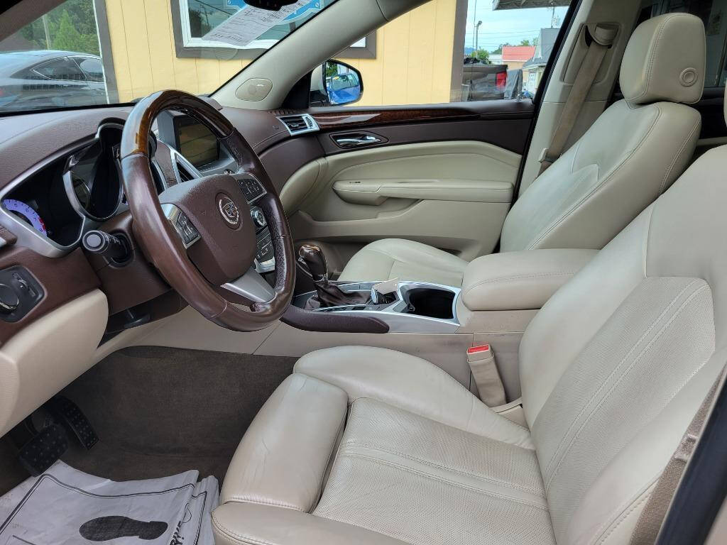 2011 Cadillac SRX for sale at DAGO'S AUTO SALES LLC in Dalton, GA