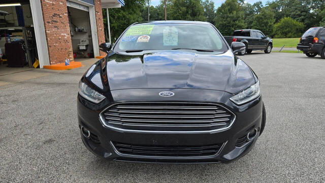 2014 Ford Fusion for sale at North Ridge Auto Center LLC in Madison, OH