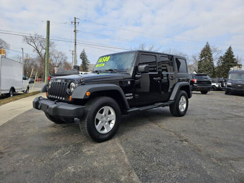 2012 Jeep Wrangler Unlimited for sale at DALE'S AUTO INC in Mount Clemens MI