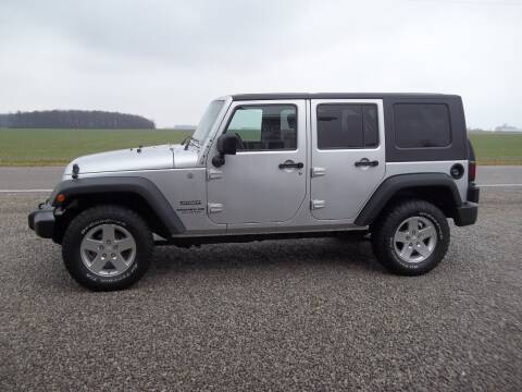 2010 Jeep Wrangler Unlimited for sale at Howe's Auto Sales in Grelton OH