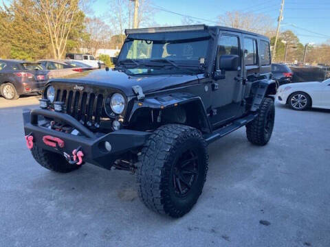 2015 Jeep Wrangler Unlimited for sale at Oak City Motors in Garner NC