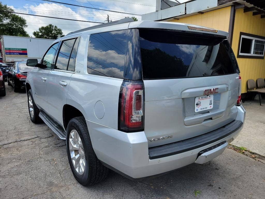 2016 GMC Yukon for sale at DAGO'S AUTO SALES LLC in Dalton, GA