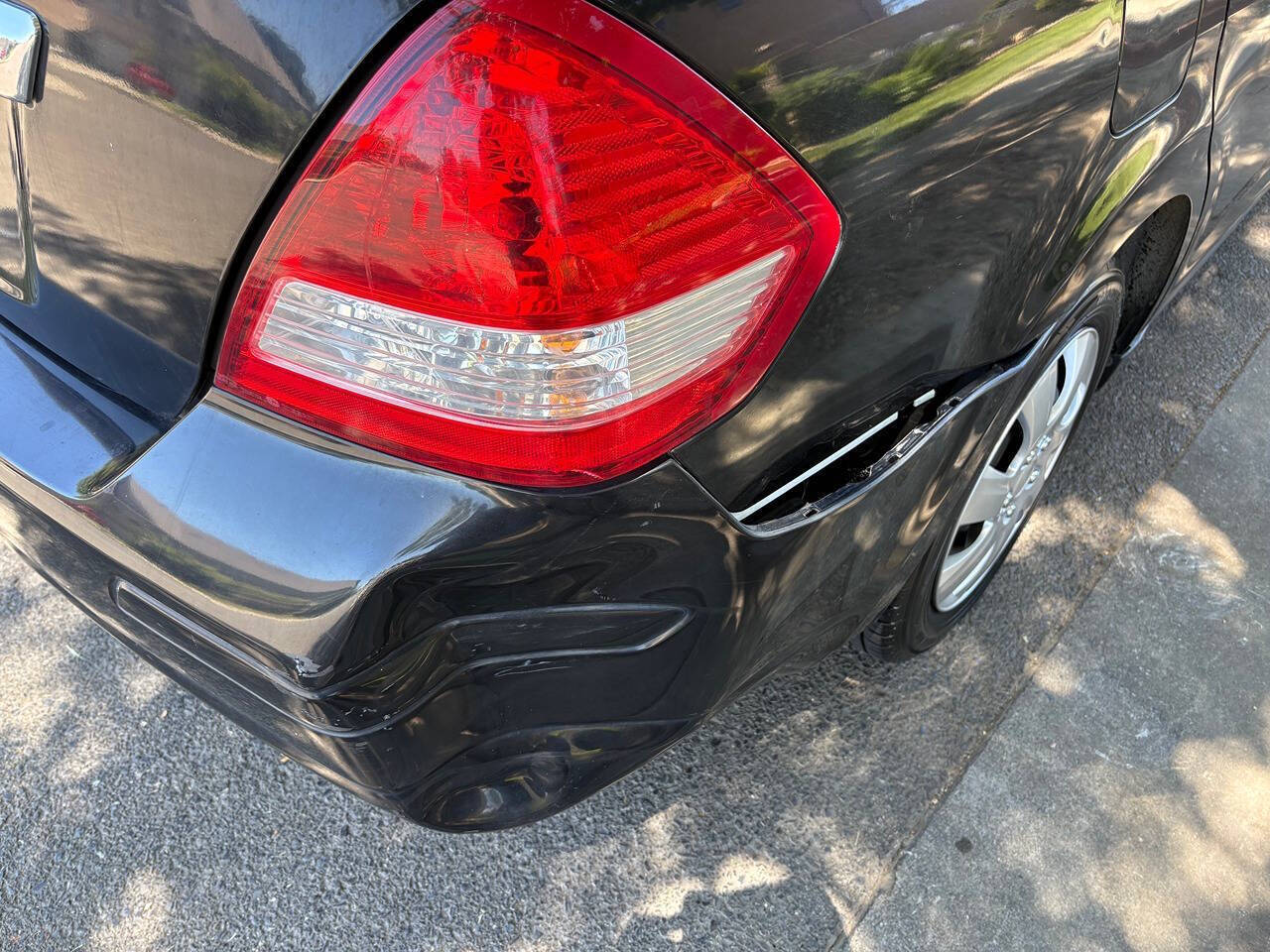 Black 2009 Nissan Versa 1.8 S 1.8 S 4dr Sedan 4A 13