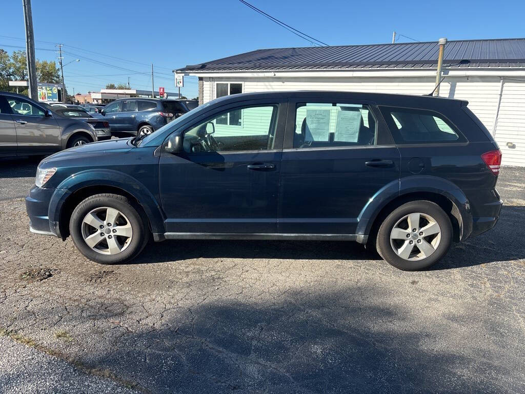 2014 Dodge Journey for sale at DECKER AUTO SALES in Bay City, MI